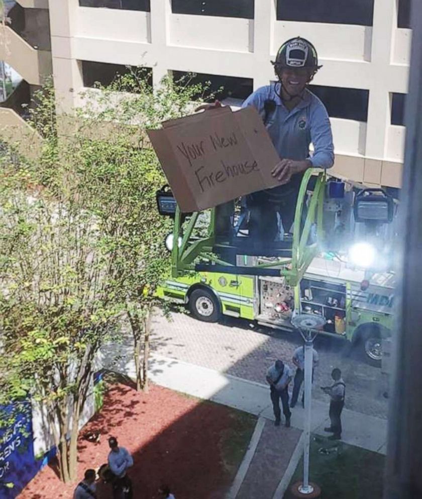 Fire crew visit fellow firefighter in the hospital using fire truck