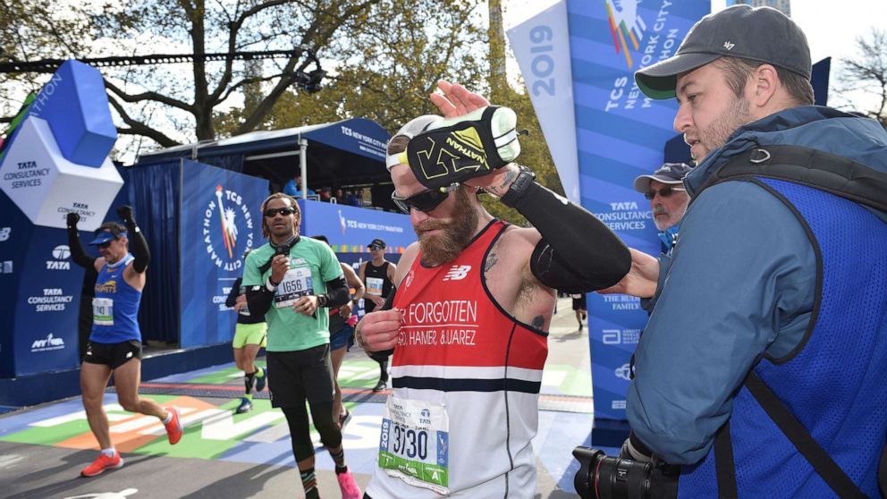 PHOTO: Micah Herndon crosses the finish line at the 2019 TCS New York City Marathon on Nov. 3, 2019 in New York City.