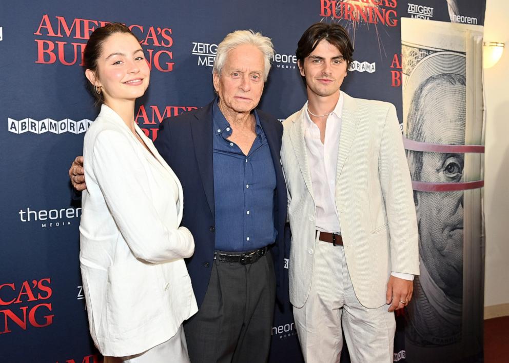 PHOTO: Carys Zeta Douglas, Michael Douglas and Dylan Douglas attend the NY Special Screening of "America's Burning" at DGA Theater on July 10, 2024 in New York City.