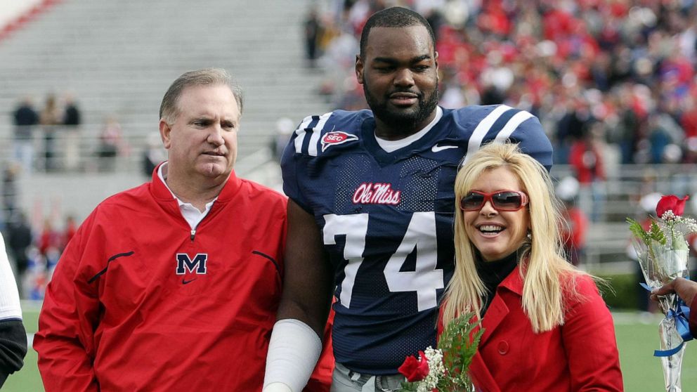 PHOTO: Michael Oher #74 of the Ole Miss Rebels stands with his family during senior ceremonies prior to a game against the Mississippi State Bulldogs at Vaught-Hemingway Stadium, Nov. 28, 2008 in Oxford, Miss.