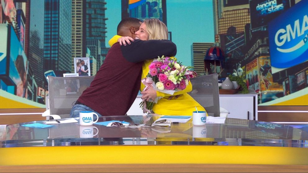 PHOTO: "GMA Day" co-hosts Michael Strahan and Sara Haines  share a hug after Haines announced that she is expecting her third child in July.