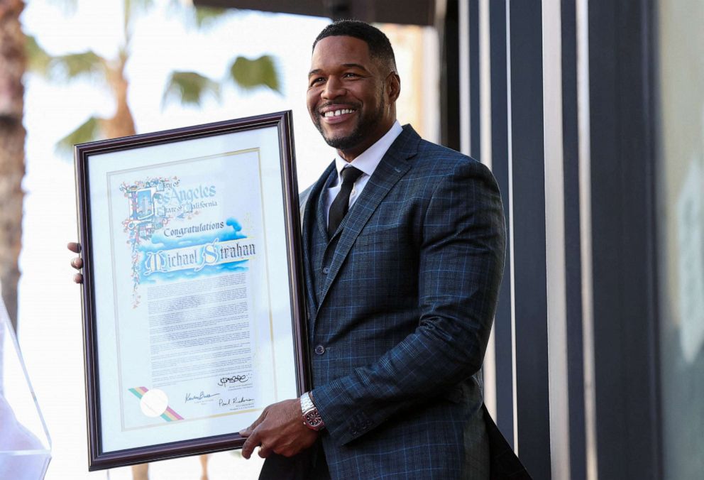 PHOTO: Television personality Michael Strahan holds a certificate of recognition during his star unveiling ceremony on the Hollywood Walk of Fame, Jan. 23, 2023, in Los Angeles, Calif.