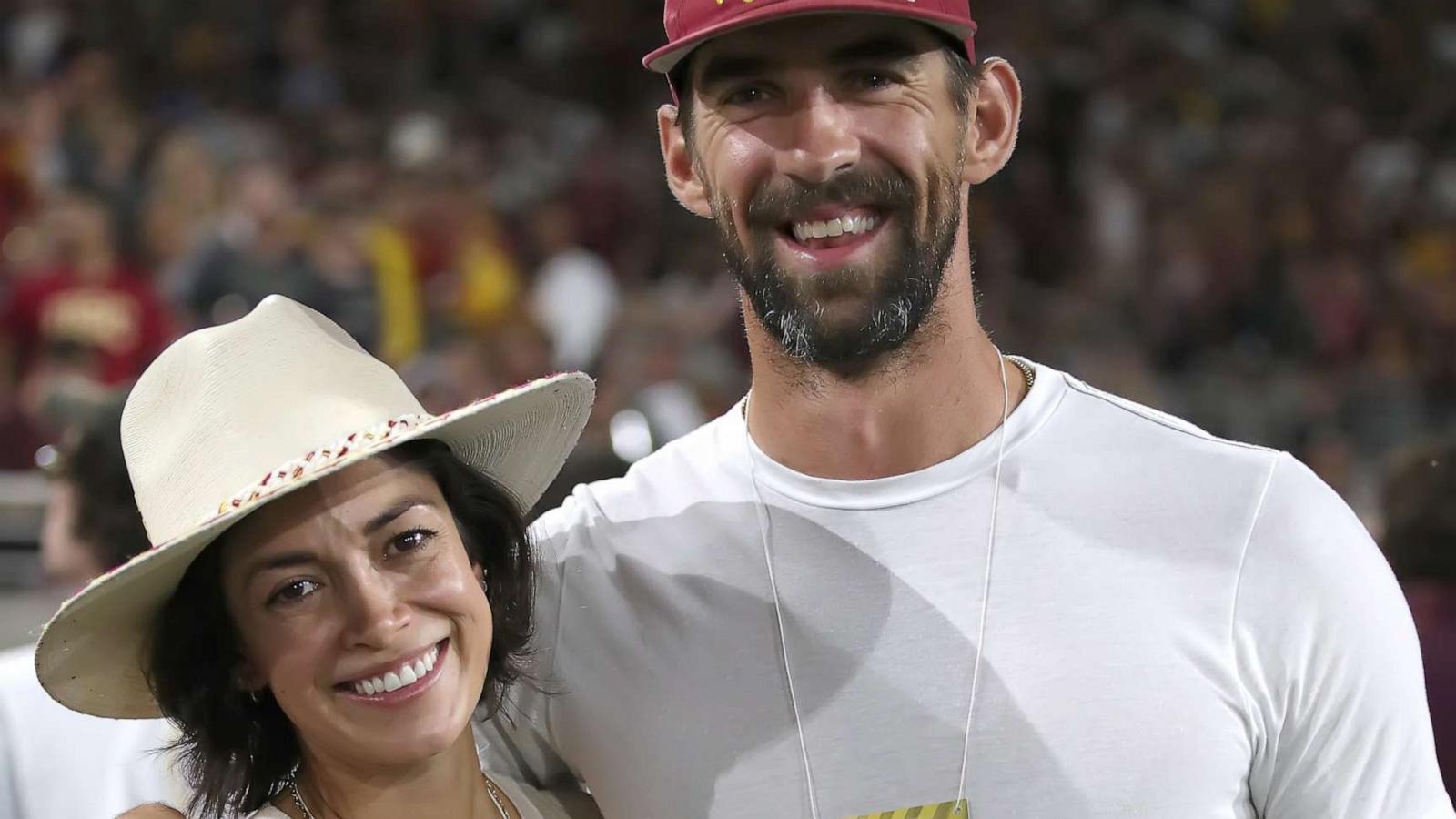 PHOTO: Michael Phelps and his wife Nicole Phelps attend a football game at Mountain America Stadium, Sept.23, 2023, in Tempe, Arizona.