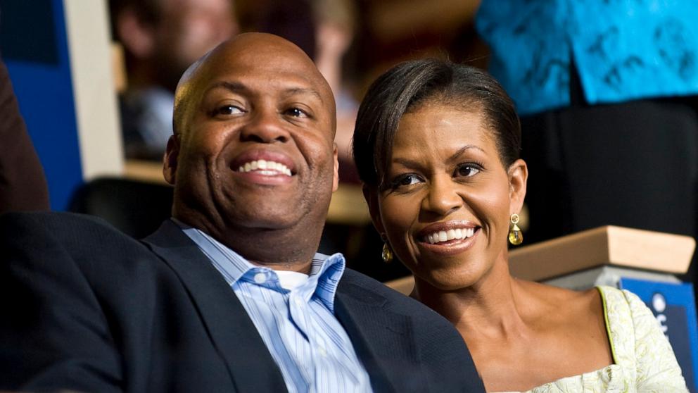 PHOTO: Michelle Obama and her brother Craig Robinson attend the Democratic National Convention in Denver, 2008.