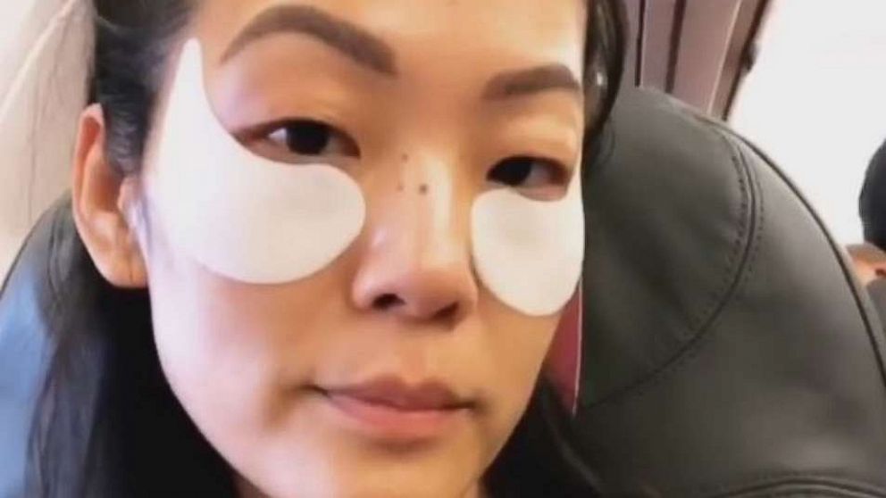 PHOTO: Michelle Lee using in-flight eye mask.