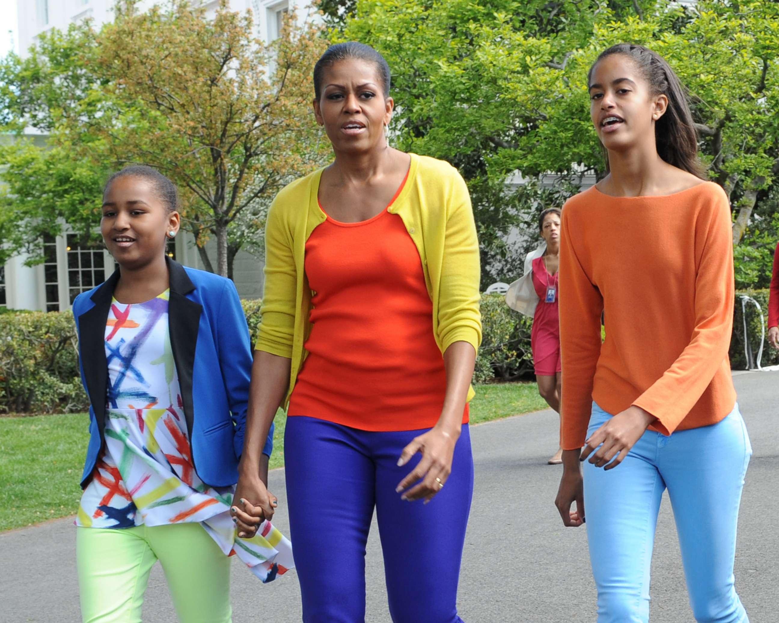 PHOTO: First lady Michelle Obama walks with daughters Sasha and Malia at the annual White House Easter Egg Roll in Washington, April 9, 2012.