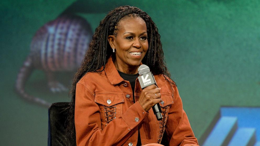 PHOTO: Michelle Obama speaks on stage during IMO Live podcast 2025 SXSW Conference and Festival at Austin Convention Center on March 13, 2025 in Austin, Texas.