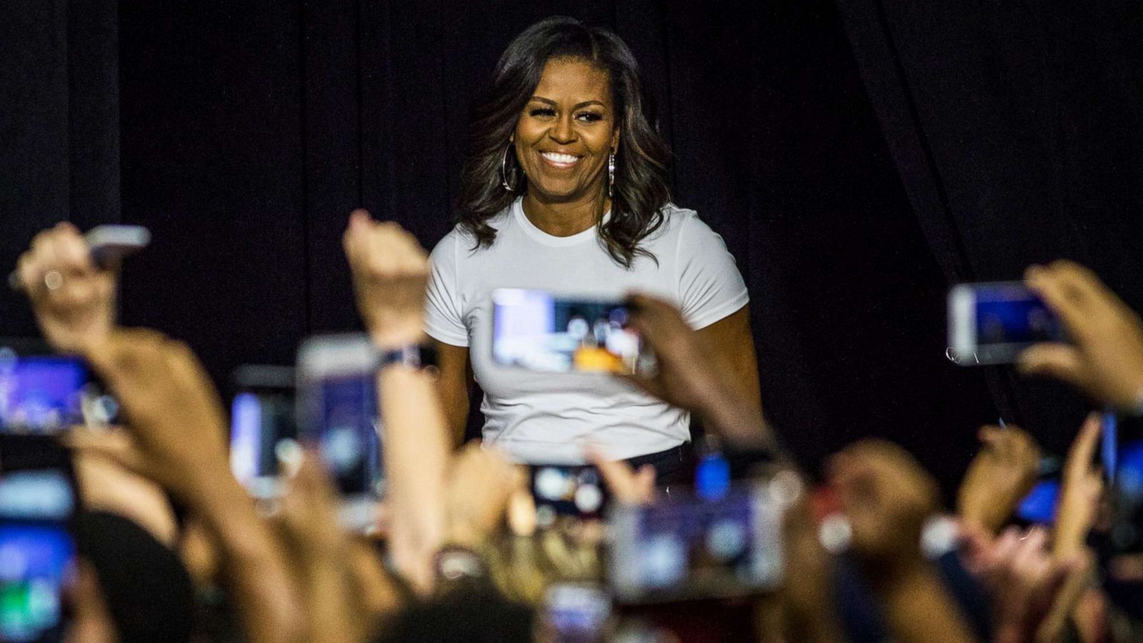 PHOTO: Former first lady Michelle Obama prepares to take the stage during an event on Sept. 23, 2018, at Chaparral High School in Las Vegas.