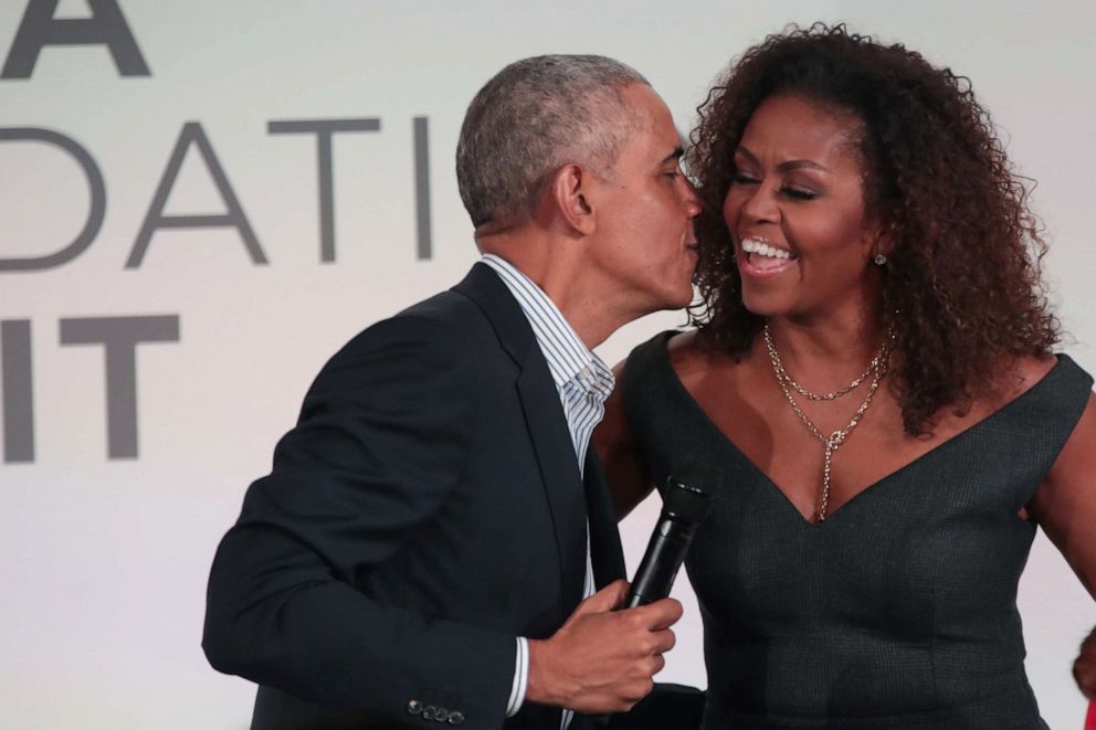 PHOTO: Former President Barack Obama gives his wife Michelle a kiss as they close the Obama Foundation Summit together on the campus of the Illinois Institute of Technology in Chicago, Oct. 29, 2019.