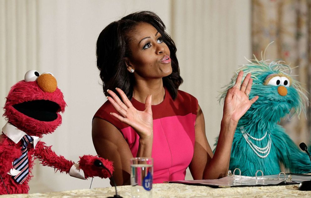 PHOTO: U.S. first lady Michelle Obama joins with Sesame Street's Elmo (left) and Rosalita for an announcement on a new initiative aimed at promoting healthier nutrition for school children, Oct. 30, 2013, in Washington, D.C.