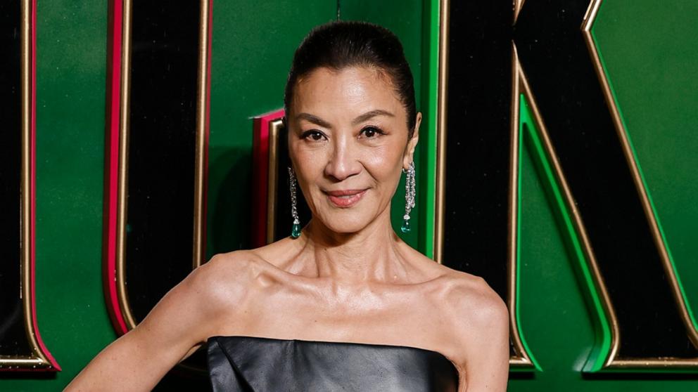 PHOTO: Michelle Yeoh poses for photographers upon arrival at the premiere of the film 'Wicked.,' Nov. 18, 2024, in London. 