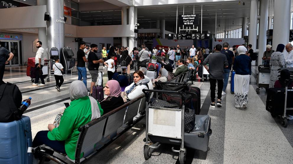 PHOTO: Passengers wait after their flights were delayed or cancelled at Rafik Hariri International Airport in Beirut, Lebanon, June 13, 2025.