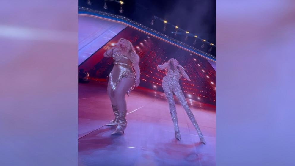 PHOTO: Beyoncé and Miley Cyrus are seen on a video screen as they perform together in Paris, France, on June 19, 2025, during the "Cowboy Carter" tour.