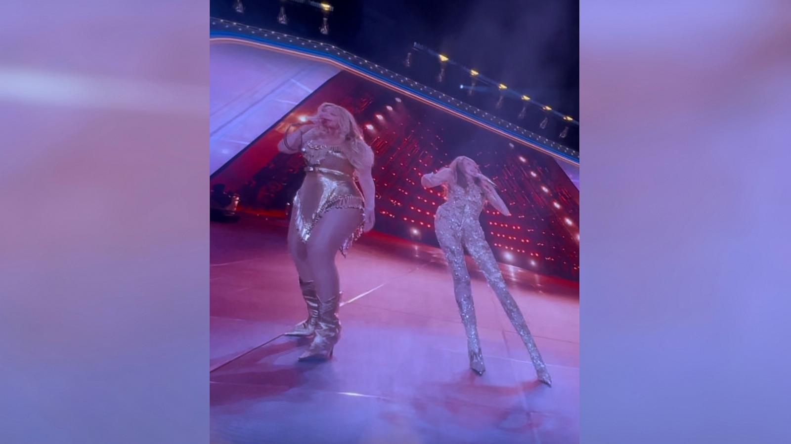 PHOTO: Beyoncé and Miley Cyrus are seen on a video screen as they perform together in Paris, France, on June 19, 2025, during the "Cowboy Carter" tour.
