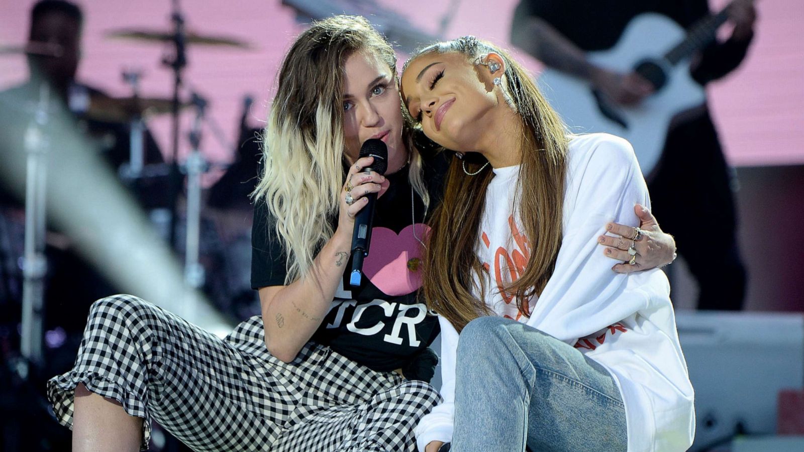 PHOTO: Miley Cyrus, left, and Ariana Grande perform on stage during the One Love Manchester Benefit Concert at Old Trafford Cricket Ground, June 4, 2017, in Manchester, England.