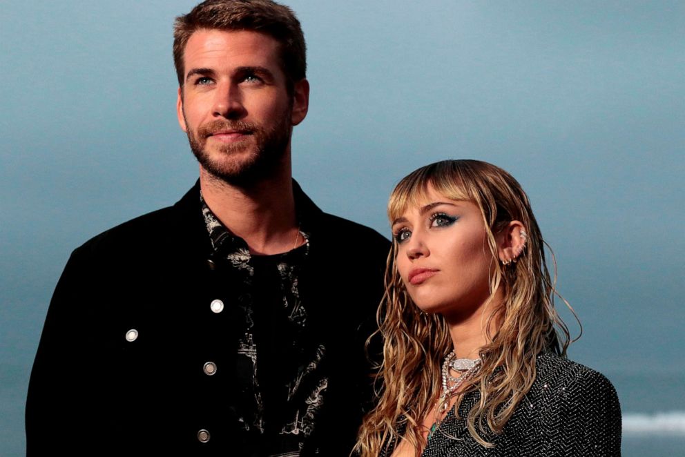 PHOTO: Miley Cyrus and husband Australian actor Liam Hemsworth arrive for the Saint Laurent Men's Spring-Summer 2020 runway show in Malibu, Calif., June 6, 2019.