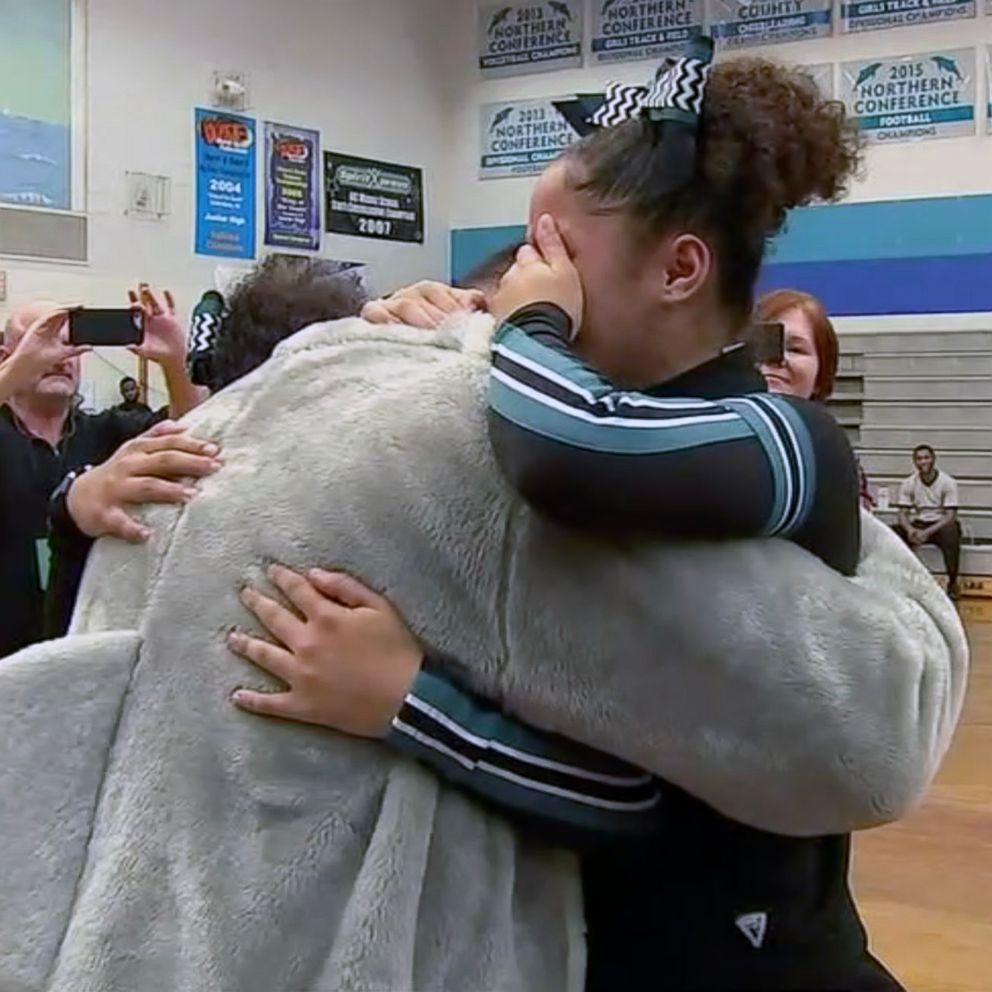 VIDEO: Sisters burst into tears as school mascot is revealed to be military dad