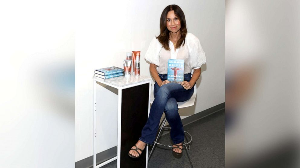 PHOTO: Minnie Driver showcases her memoir, "Managing Expectations", at Ulta Beauty in Westwood Village, Los Angeles.