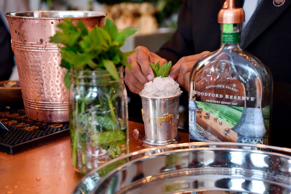 PHOTO: Bartender Ron Jones makes a mint julep before the Kentucky Derby at Churchill Downs in Louisville, Ky., May 6, 2017.