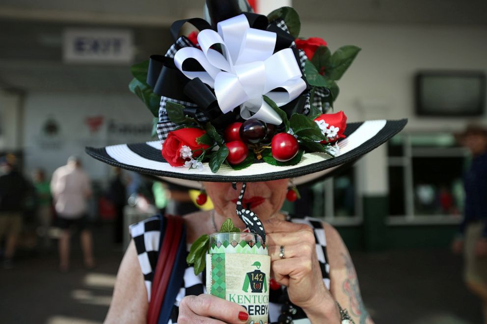 PHOTO: A fan enjoys a mint julep before the 142nd running of the Kentucky Derby at Churchill Downs in Louisville, Ky., May 7, 2016.