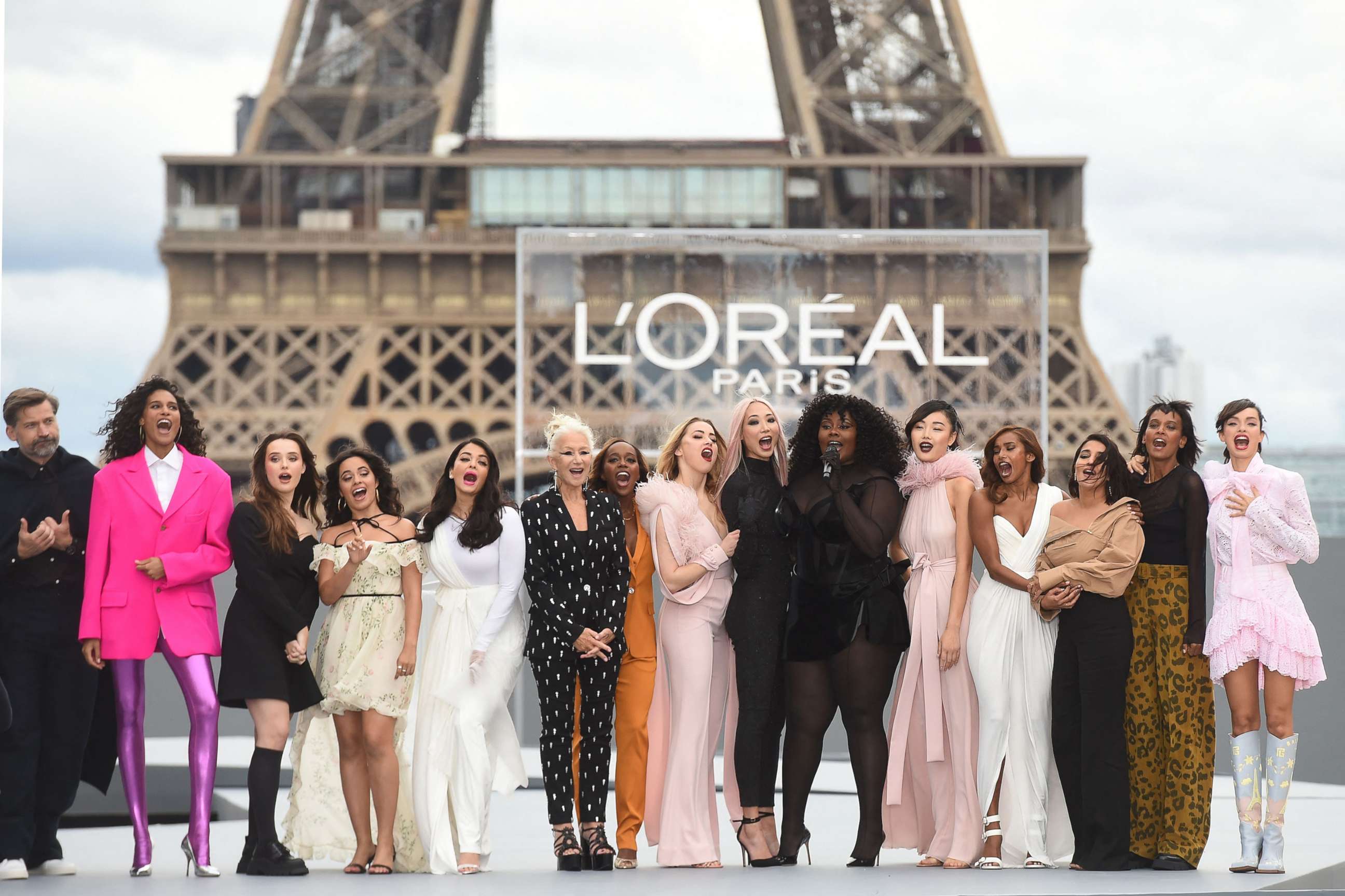 PHOTO: Actress Helen Mirren, wearing a black and white pantsuit, stands with other models for a photo during the L'Oreal show at Paris Fashion Week at the Trocadero, in Paris on Oct. 3, 2021.