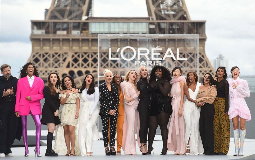 PHOTO: Actress Helen Mirren, wearing a black and white pantsuit, stands with other models for a photo during the L'Oreal show at Paris Fashion Week at the Trocadero, in Paris on Oct. 3, 2021.