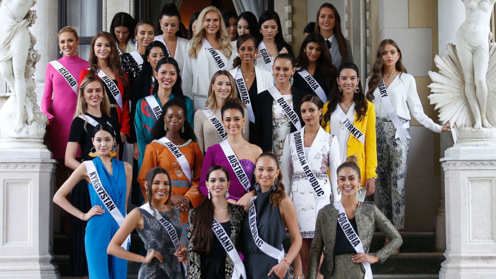 PHOTO: Miss Universe 2018 contestants pose for photos as the visit the Government House after their meeting with Thai Prime Minister in Bangkok on December 11, 2018.