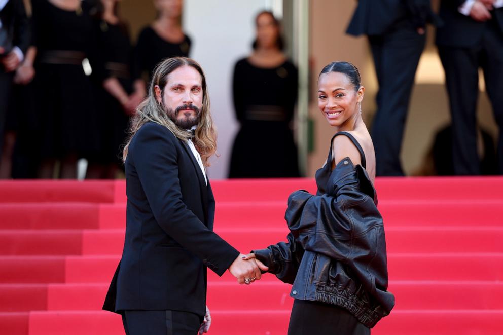 PHOTO: Marco Perego and Zoe Saldana attend the "Mission Impossible - The Final Reckoning" red carpet at the 78th annual Cannes Film Festival at Palais des Festivals on May 14, 2025 in Cannes, France.