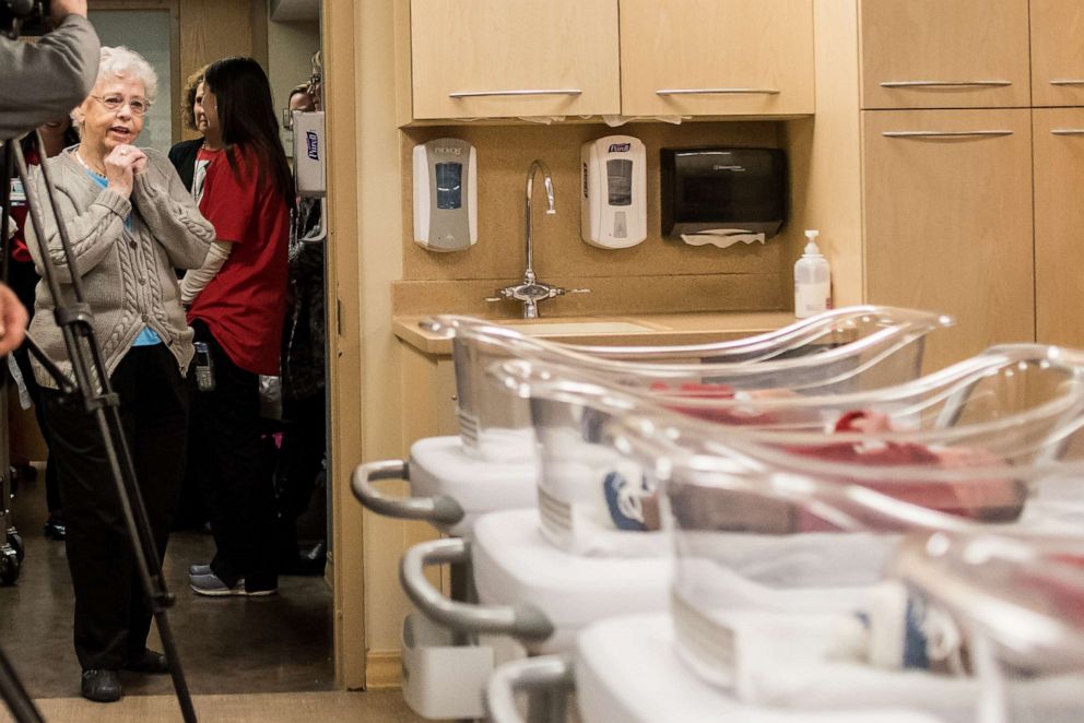 PHOTO: Mrs. Joanne Rogers, widow of the late Mister Rogers, looks at the newborns honoring her husband.