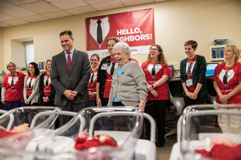 PHOTO: UPMC Magee-Womens Hospital president Richard Beigi, Mrs. Rogers, and Caitlin Pechin, the nurse who made the outfits, visit the newborns.