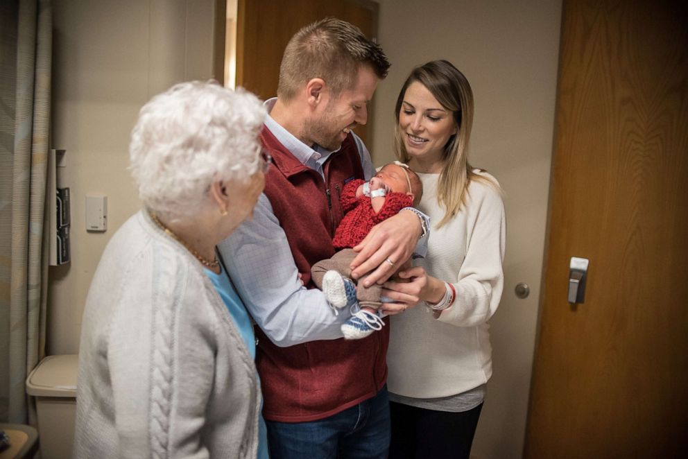 PHOTO: Mrs. Joanne Rogers meets with Kristen and Michael Lewandowski and their newborn Mary Rose.