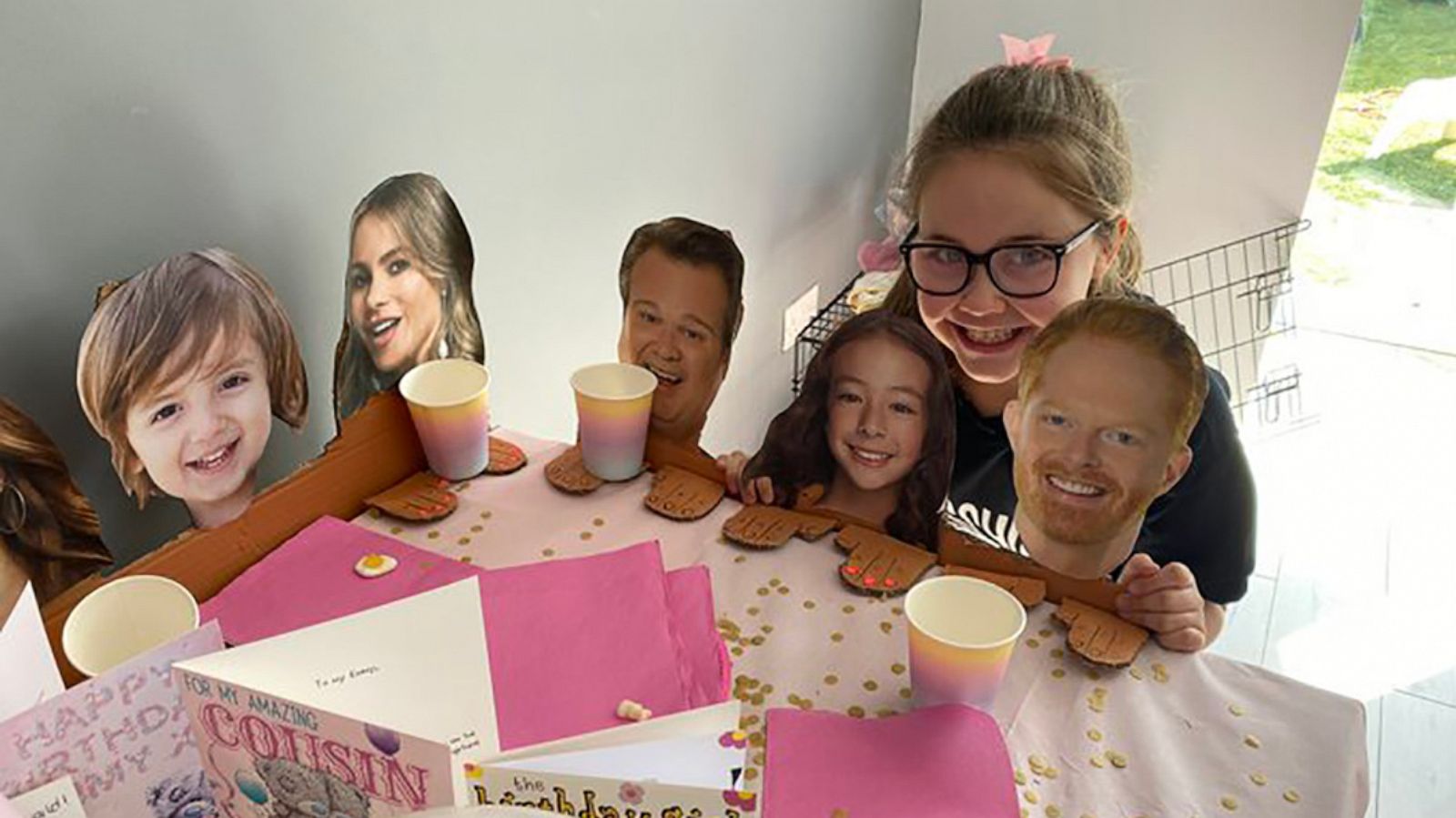 PHOTO: Emma McClelland of Liverpool, England, celebrates her 10th birthday with cutouts of the "Modern Family" cast.