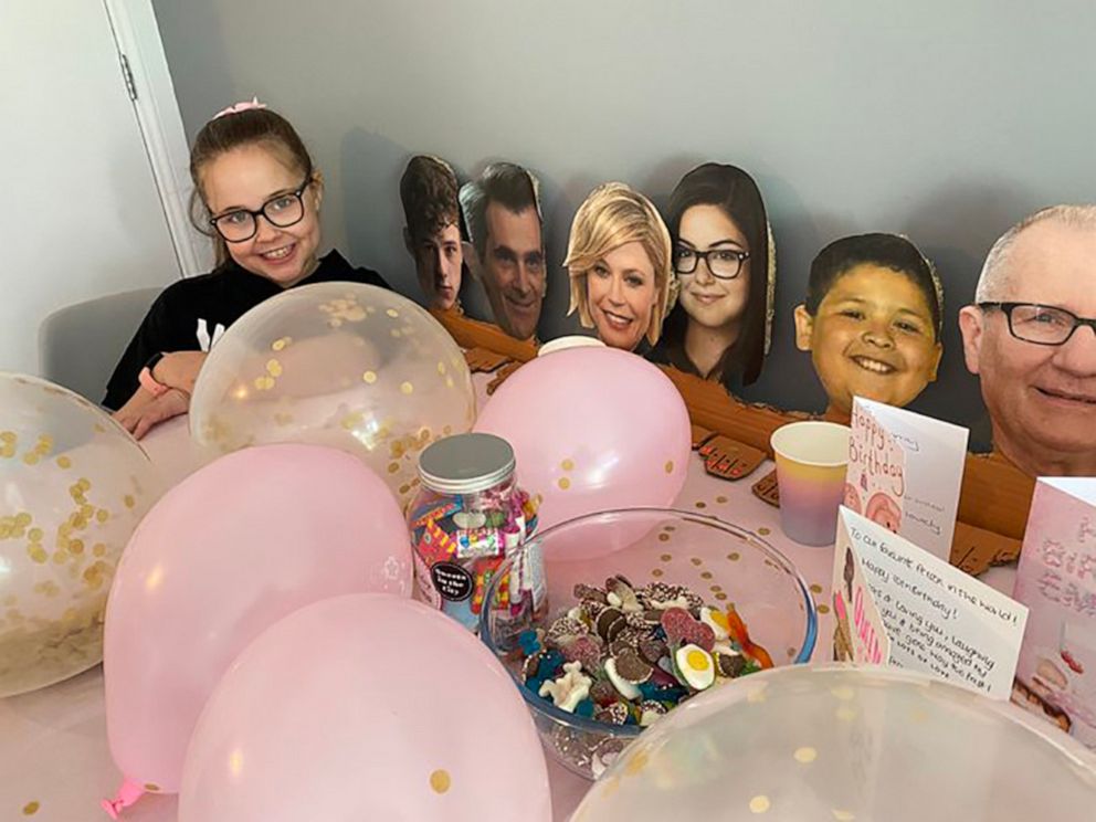 PHOTO: Emma McClelland poses with cutouts of the "Modern Family" cast while celebrating her 10th birthday in Liverpool, England.