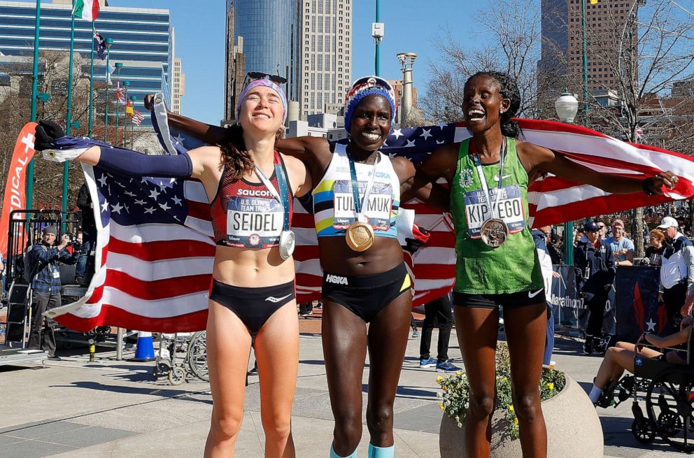 PHOTO: Molly Seidel, Aliphine Tuliamuk, and Sally Kipyego pose after finishing in the top three of the Women's U.S. Olympic marathon team trials on Feb. 29, 2020, in Atlanta.