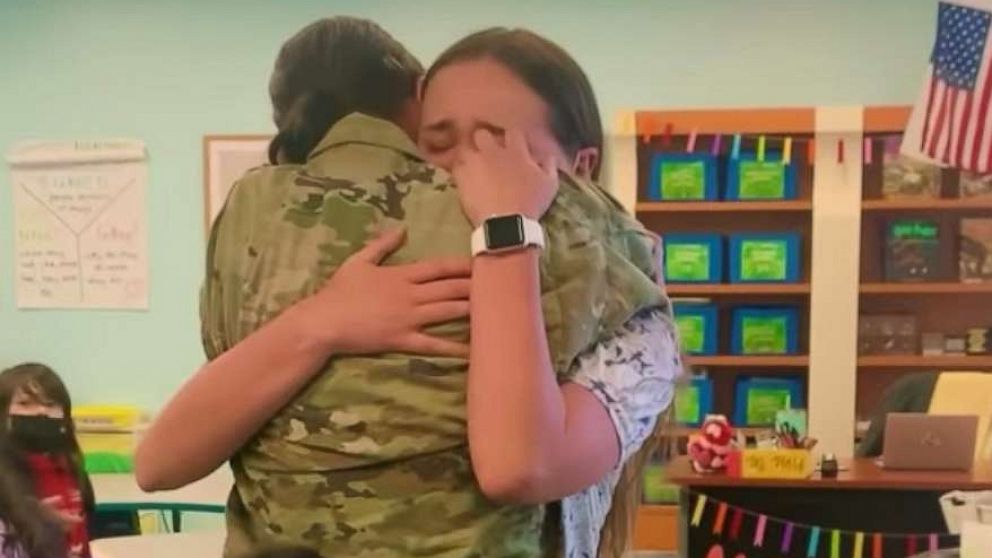 PHOTO: Tamie and Samantha Norris shared a hug after Tamie Norris surprised her teacher daughter in her classroom.