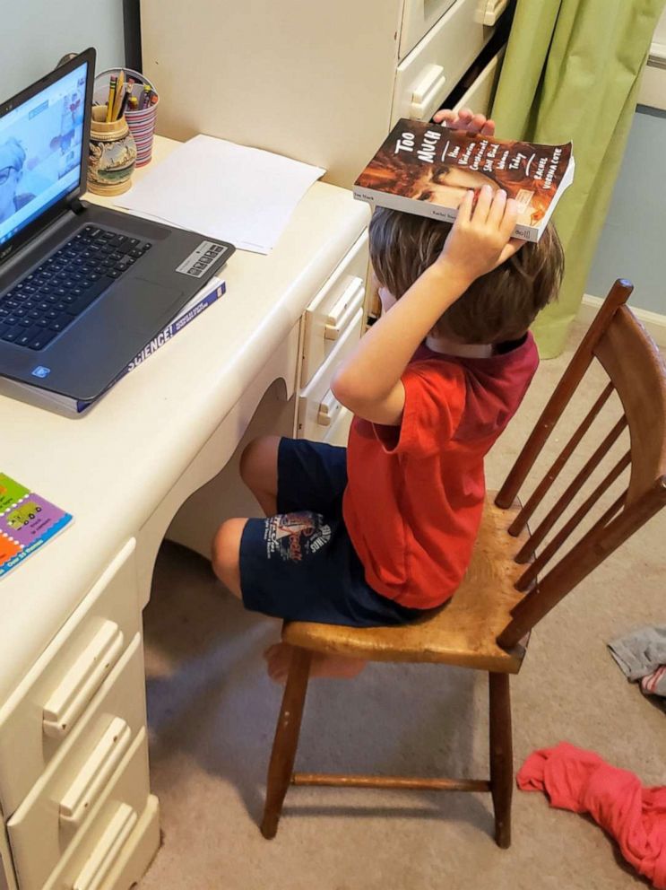 PHOTO: Charlie Lewis, age 6, is seen learning kindergarten remotely from his home in Silver Spring, Maryland.