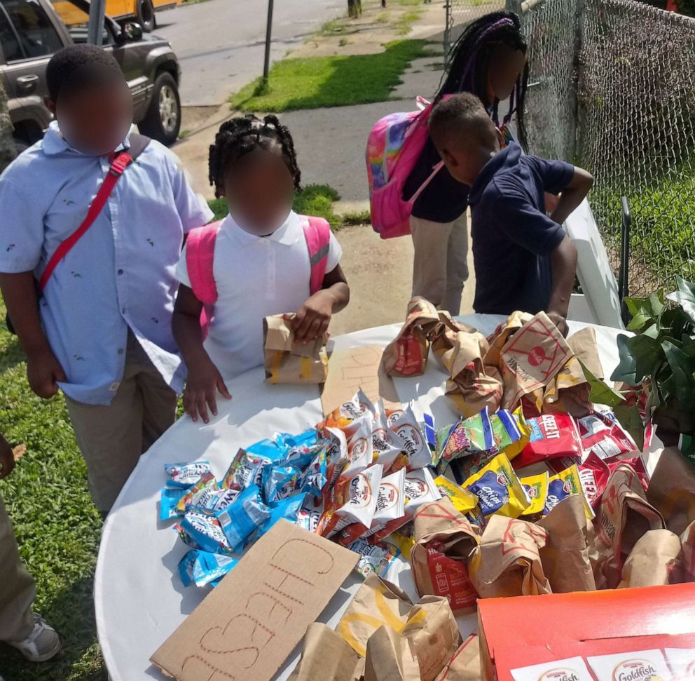 PHOTO: Kids stop by Champale Anderson's home after school to pick up food.