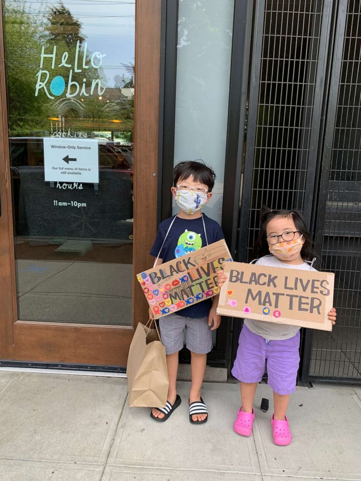 PHOTO: Siblings Bennett, 7 and Ruby Kang, 5, hold Black Lives Matter signs in the Seattle, Washington, area.