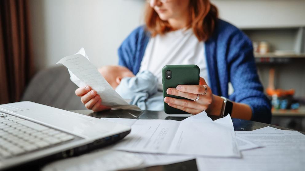 PHOTO: Stock photo of a mother tending to finances.