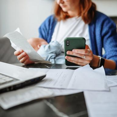 PHOTO: Stock photo of a mother tending to finances.