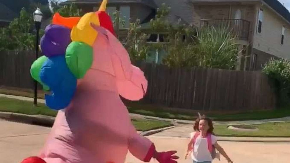 PHOTO: Dad Chris Scandridge filmed last week as his wife Somer Scandridge danced up the block in her giant, pink costume to greet 6-year-old Madison.