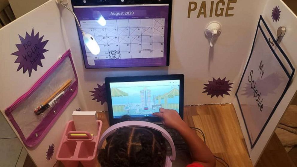 PHOTO: Angelina Harper, a special education teacher from Louisville, Kentucky, crafted work stations for each of her children, Aubrie, 8 and twins Paige and Peyton, 6.