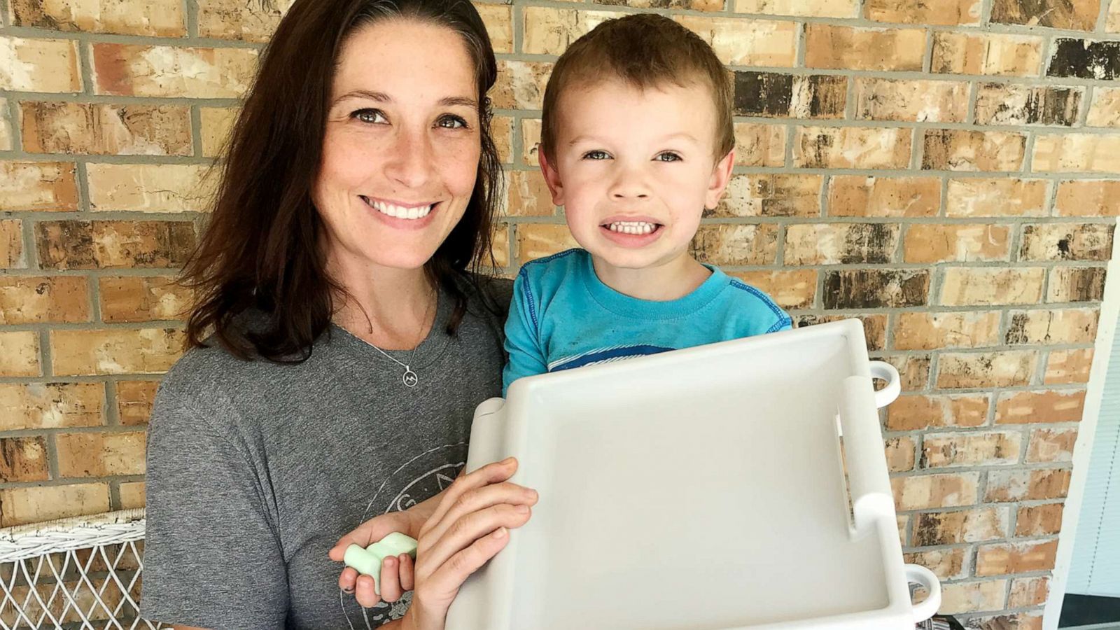 PHOTO: Nichole Clark poses with her son Jonah holding the Buggie Huggie product she invented.