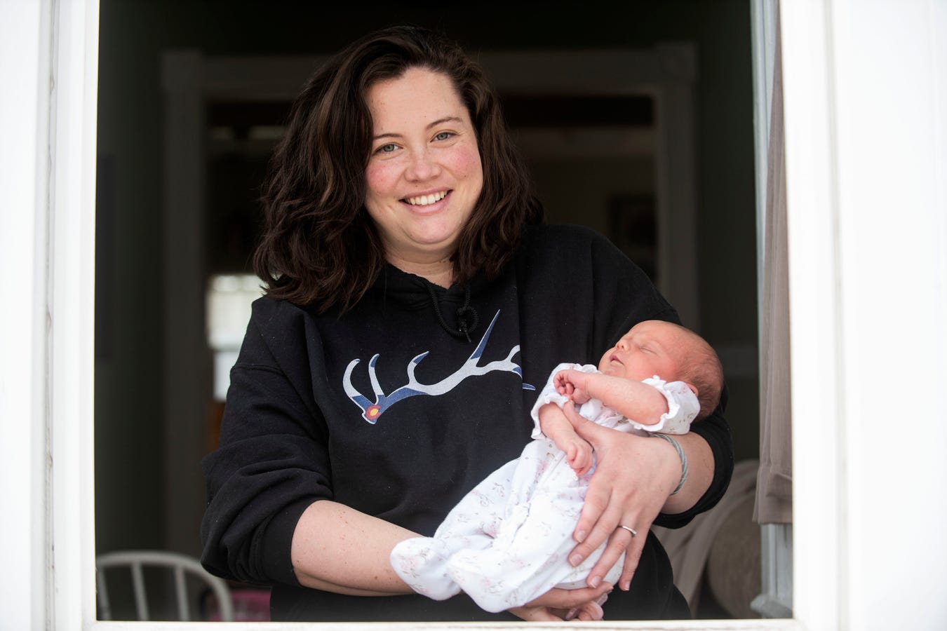 PHOTO: Mallory Pease holds her newborn daughter Alivia after recovering from COVID-19 on April 7, 2020, at their home in Homer, Mich.