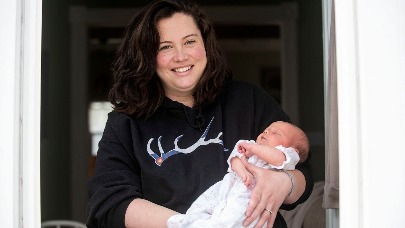 PHOTO: Mallory Pease holds her newborn daughter Alivia after recovering from COVID-19 on April 7, 2020, at their home in Homer, Mich.