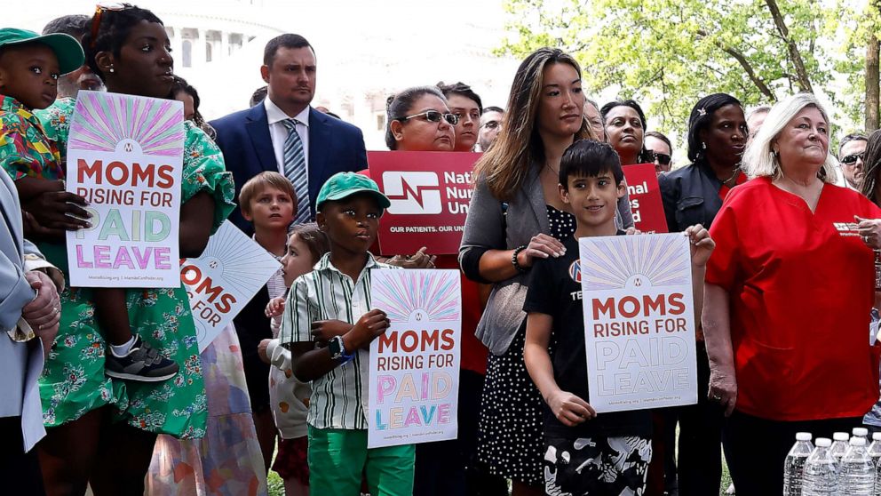 PHOTO: MomsRising members and their kids attend a picnic on Capitol Hill to urge Congress to make child care affordable, pass paid leave, support care infrastructure, and raise the debt ceiling, May 17, 2023 in Washington.