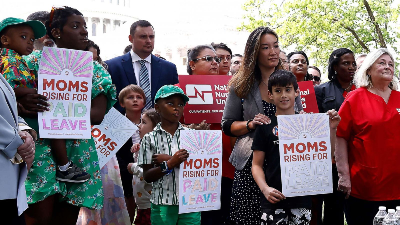 PHOTO: MomsRising members and their kids attend a picnic on Capitol Hill to urge Congress to make child care affordable, pass paid leave, support care infrastructure, and raise the debt ceiling, May 17, 2023 in Washington.