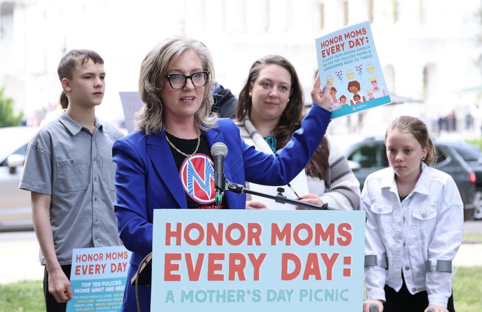 PHOTO: Kristin Rowe-Finkbeiner, MomsRising Executive Director/CEO joins members and their kids at a picnic on Capitol Hill to urge Congress to make child care affordable, pass paid leave, and support care infrastructure, May 17, 2023, in Washington.