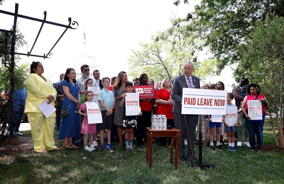 PHOTO: Senate Majority Leader Chuck Schumer joins MomsRising members and their kids at a picnic on Capitol Hill to urge Congress to make child care affordable, pass paid leave and support care infrastructure, May 17, 2023 in Washington.