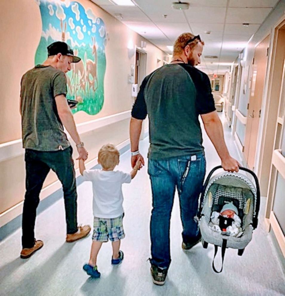 PHOTO: Madison Holley of Corunna, Ontario, shared an image of her former partner and current fiance exiting the hospital hand-in-hand with her toddler son, along with her newborn